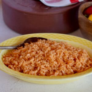 A yellow dish holds Authentic Mexican Style Rice.