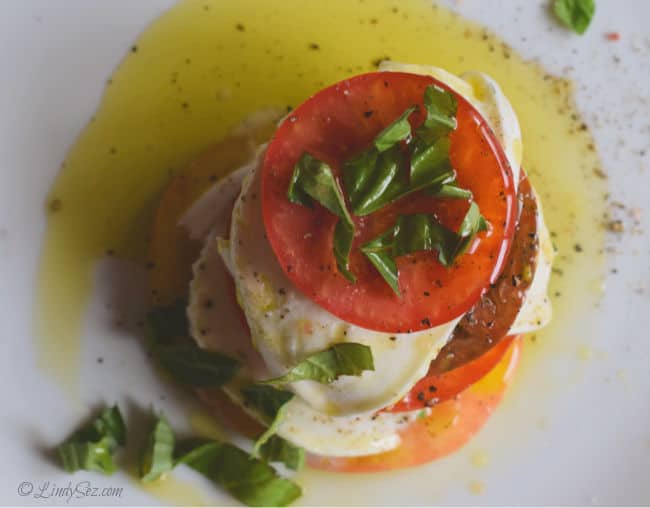 An overhead view of a classic caprese salad showing off the colorful tomatoes.