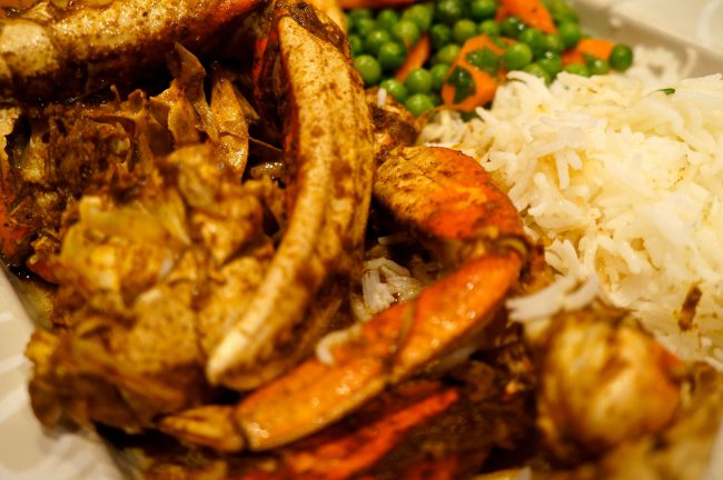 Moroccan Dungeness Crab Tagine served up with rice and peas