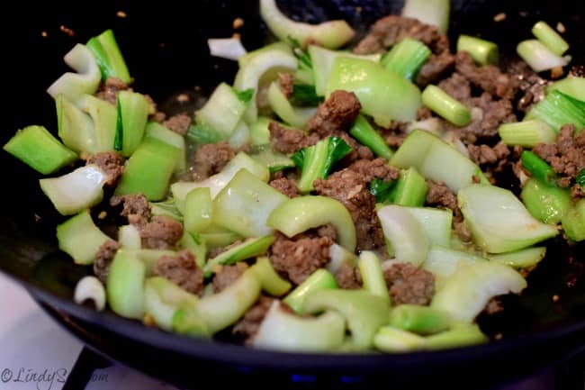 Chinese Style Noodles with Ground Lamb and Bok Choy bok choy and lamb in skillet