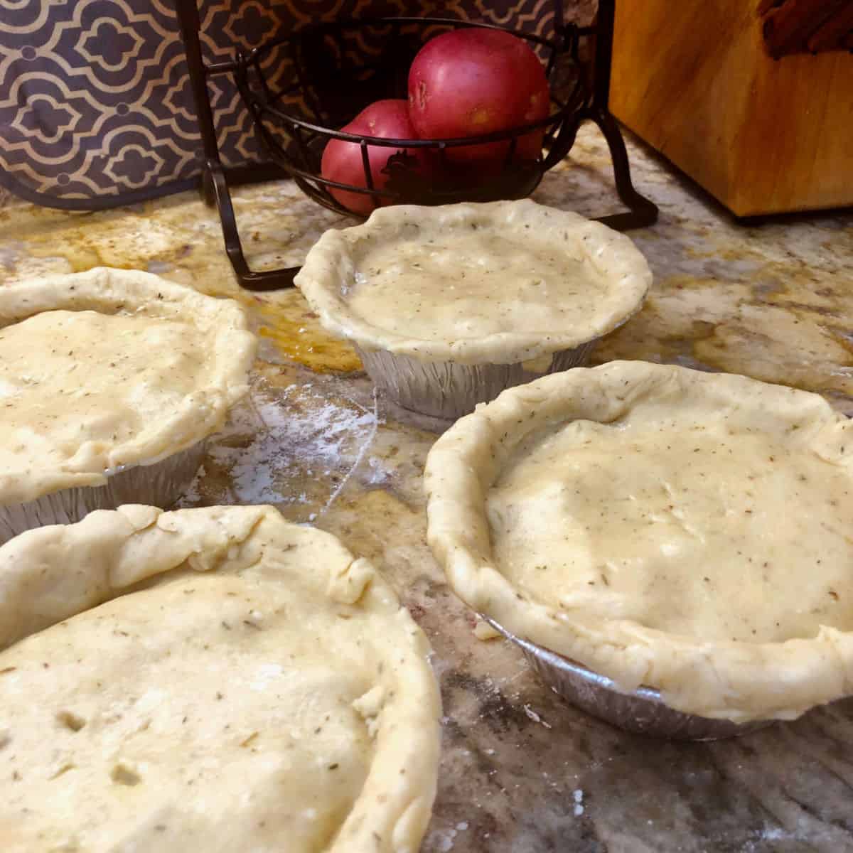 The finished pies with crusts folded in.