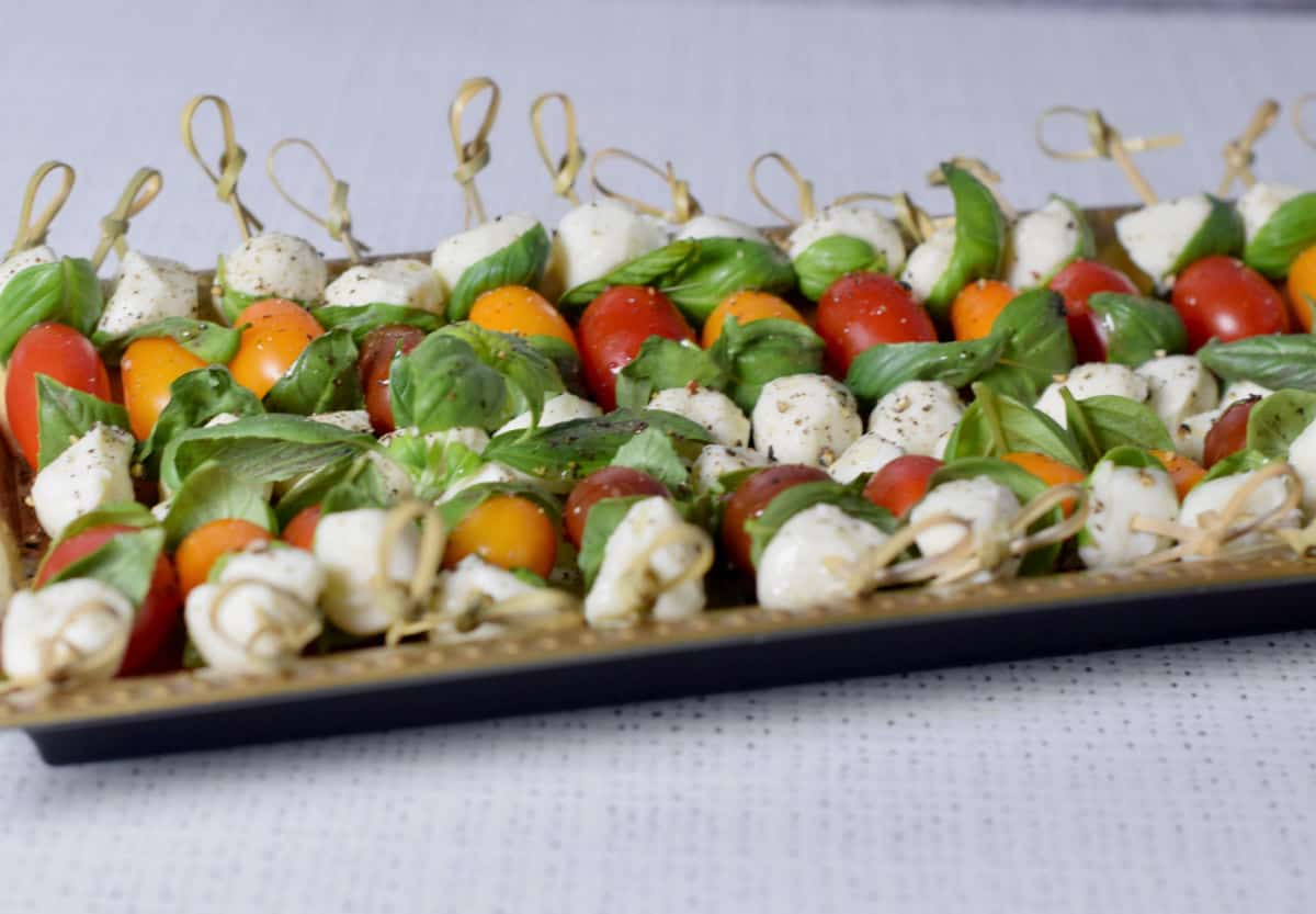 A plate of skewered Caprese Salad.