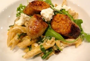 Garlic Chicken Sausage on Whole Wheat Pasta with Wilted Arugula and Goat Cheese