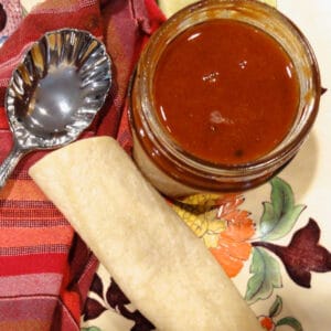 Homemade Red Enchilada sauce with a corn tortilla.