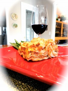 vegetable lasagna with a glass of wine