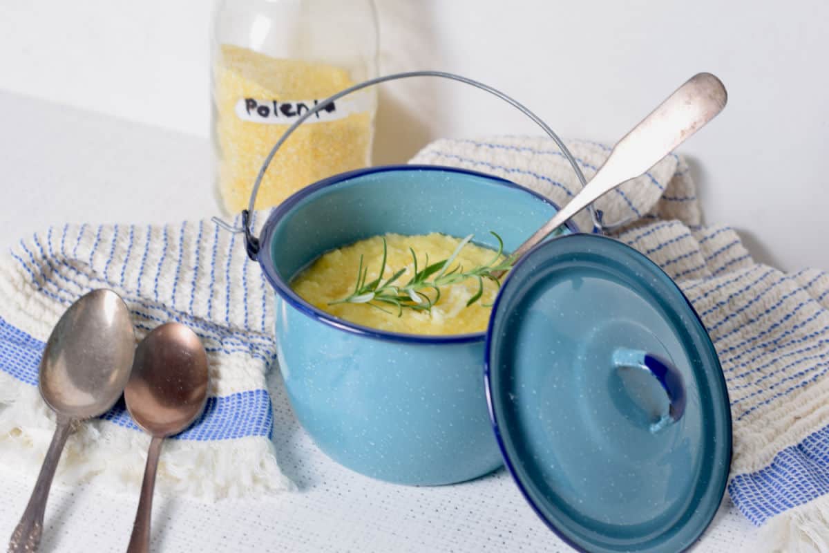 Polenta in a pot being ready to be served.