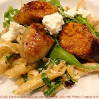 Garlic Chicken Sausage on Whole Wheat Pasta with Wilted Arugula and Goat Cheese