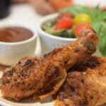 Dancing chicken cooked and on a plate with embellishments.