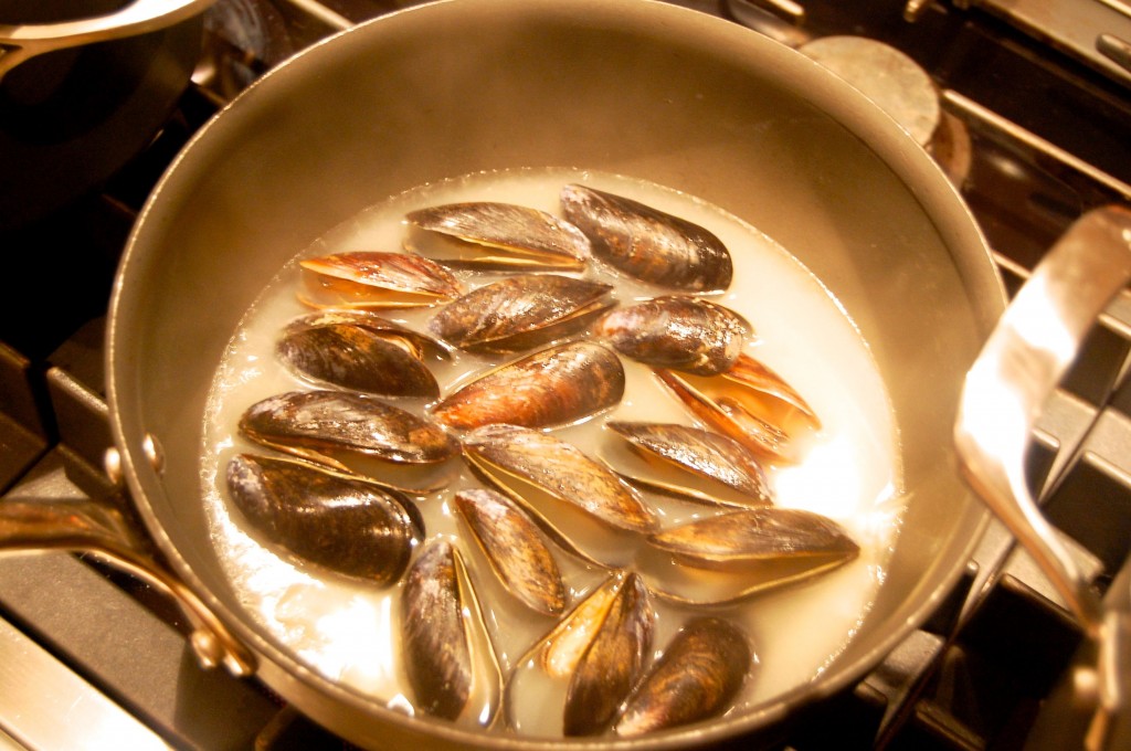 mussels simmering in broth