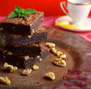 Fudgy chocolate brownies on a plate with a nice cup of coffee.