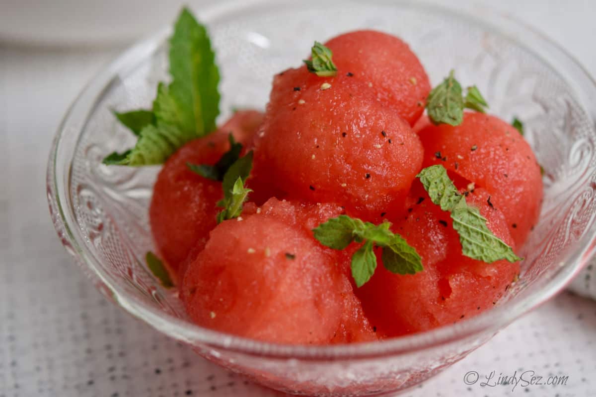 A bowl with fresh dairy free minted watermelon salad in it.