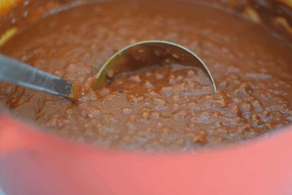 Chili Sauce with a ladle and showing the beautiful sauce