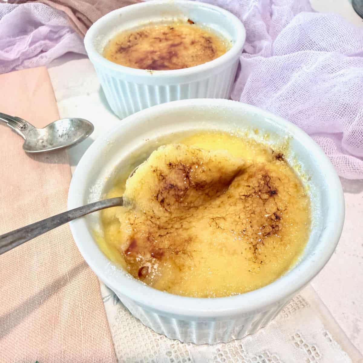 Sweet Corn Creme Brulee in a white ramikin with burnt sugar topping.