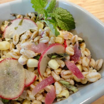 A bowl of Farrow and Corn Salad.