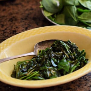 A bowl of wilted spinach.
