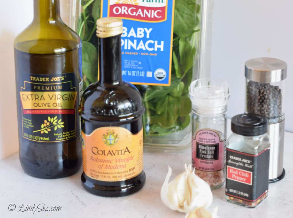 The ingredients you need to make fresh spinach saute.
