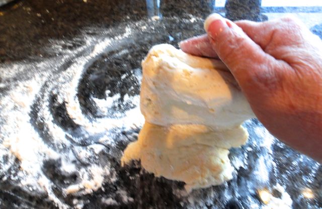 kneading the dough for super simple cream biscuits