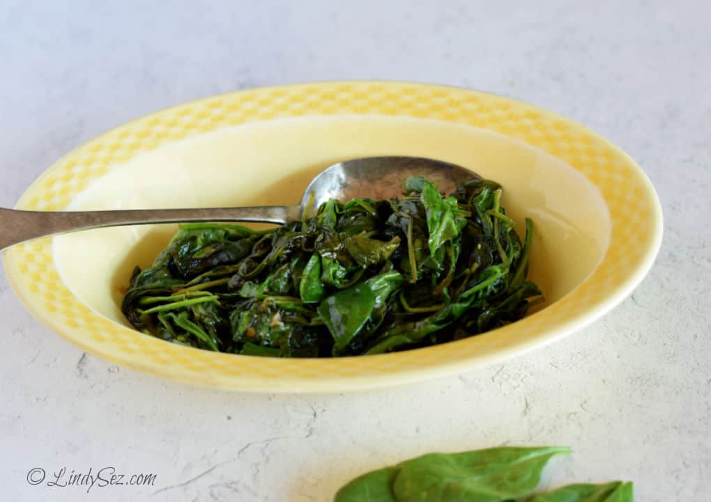 Fresh Spinach Saute in a yellow bowl.