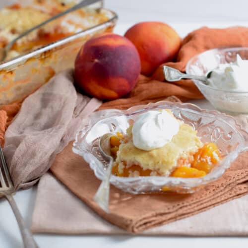 Eash Peach Cobbler with optional whipped cream.