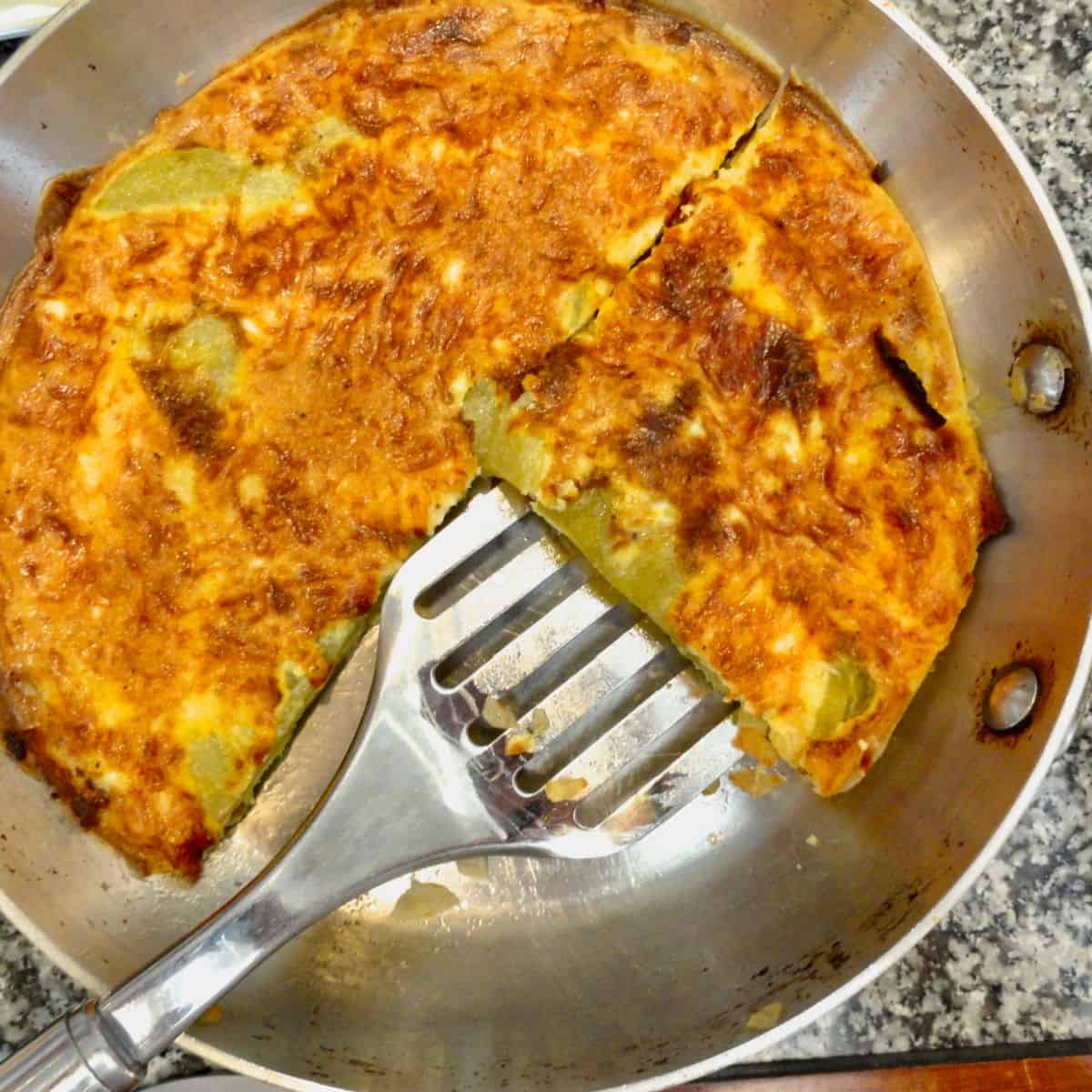 Chili Relleno Frittata being cut and served.