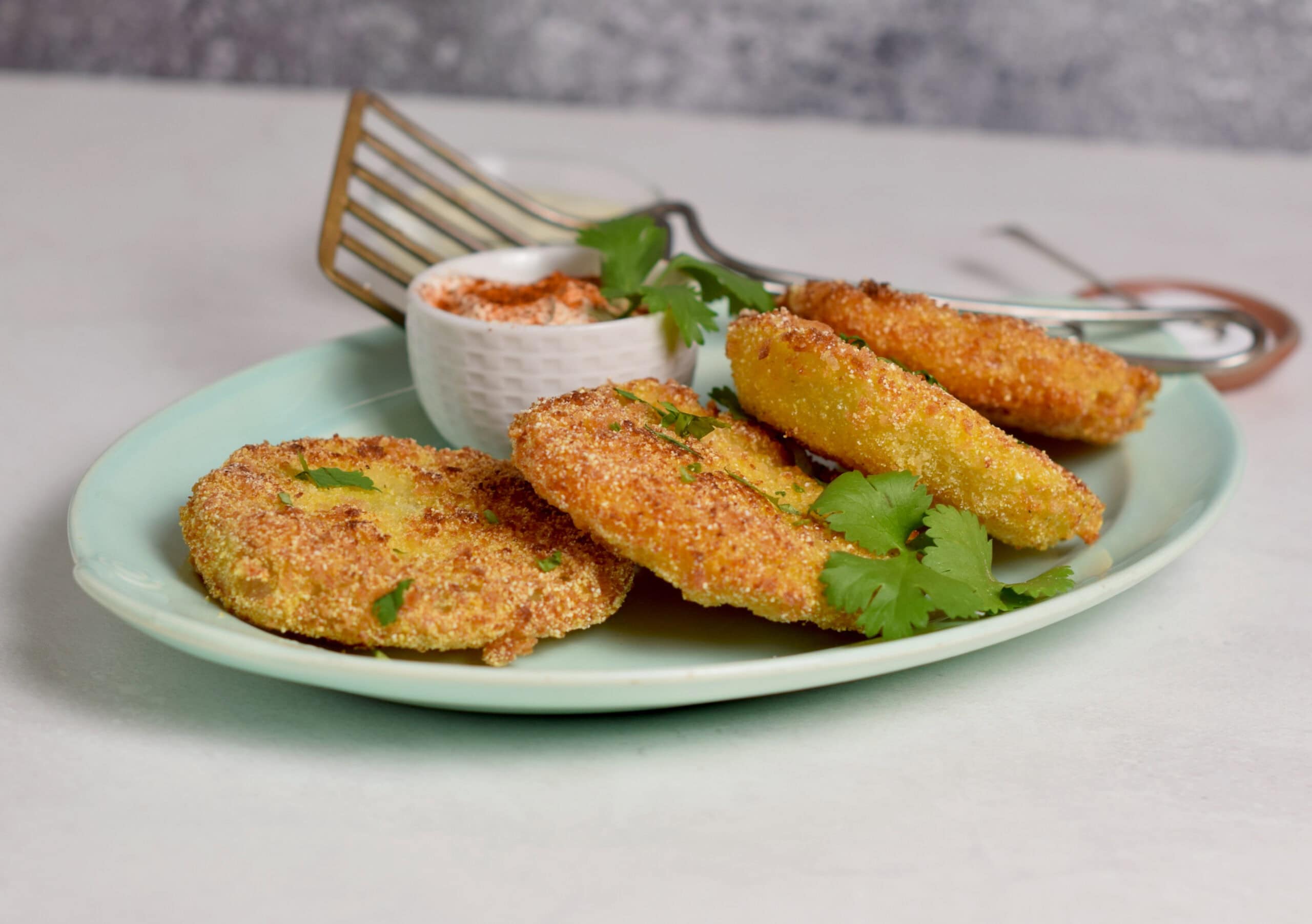 A plate of crispy double dipped Fried Green Tomatoes. 