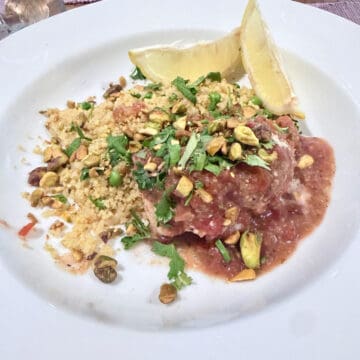 A place with Churmoula baked whitefish along side some couscous.