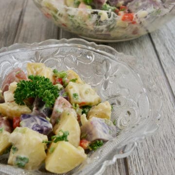 Colorful potatoes in a glass bowl.