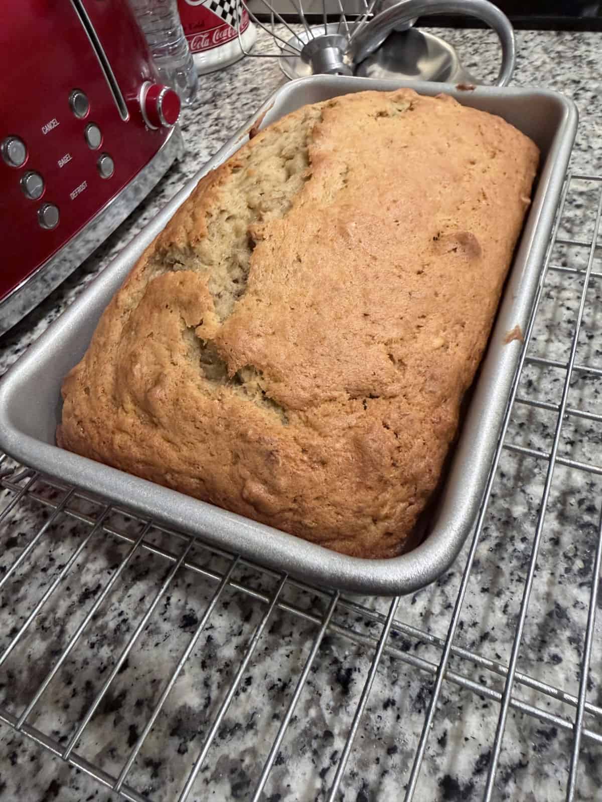 Freshly baked banana bread in a loaf pan.