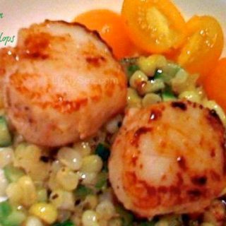 fresh corn with seared scallops on a plate
