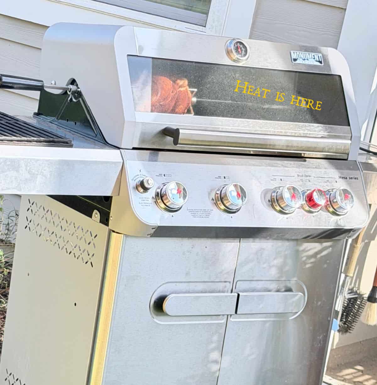 A gas grill showing how to off-set cooking.