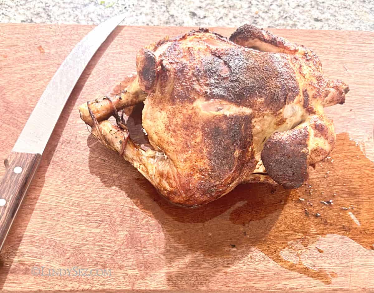 A cooked chicken with brown skin.