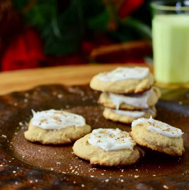 A platter with eggnog cookies, frosted and topped with fresh nutmeg.