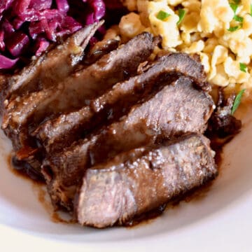 Rich wine gravy tops slices of tender Sauerbraten.