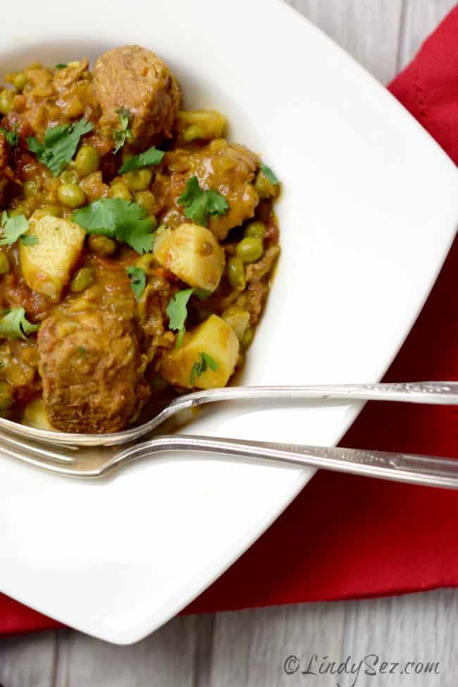 Tagine of Pork with Sweet Potato and Ras-el-hanout on white dish