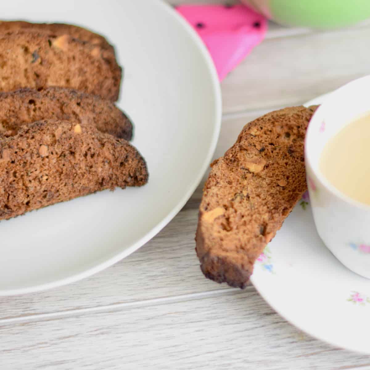 Crispy zucchini carrot biscotti on a plate ready to enjoy with a cup of coffee or tea.