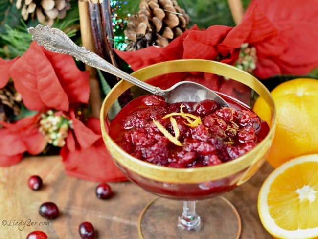 an antique bowl filled with Easy Fresh Cranberry Orange Sauce