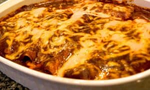a finished casserole of fully loaded cheese enchilada
