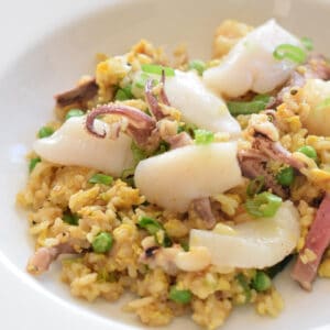Calamari, shrimp, and steak combine to make Surf and Turf Curried Fried Rice.