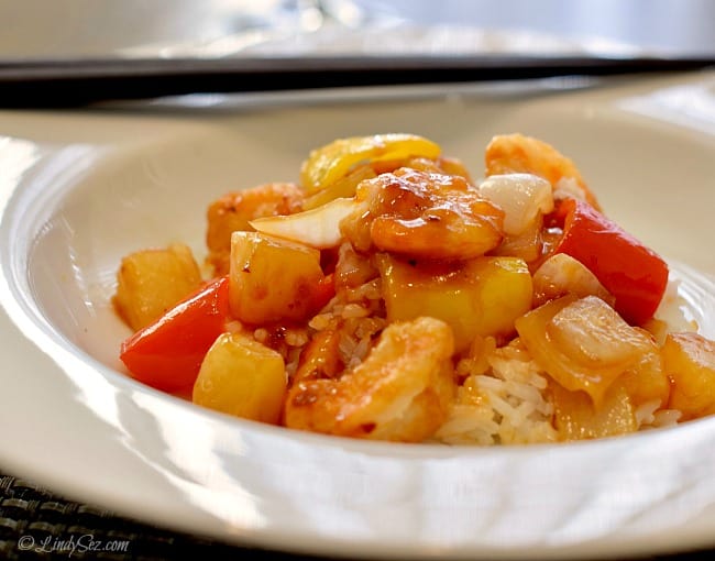 a well sauced plate of spicy sweet and sour shrimp