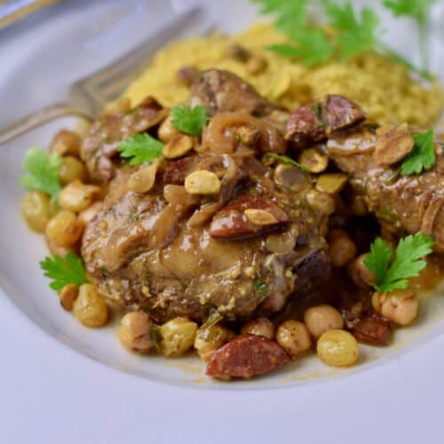 Spanish Style Braised Chicken with Spanish Chorizo in a bowl with rice.