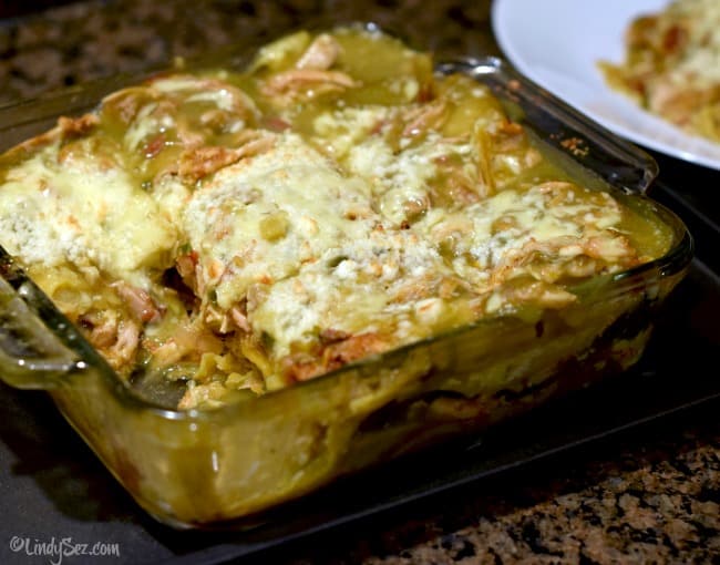 a casserole dish with Green Chili Chicken Enchilada Stack in it