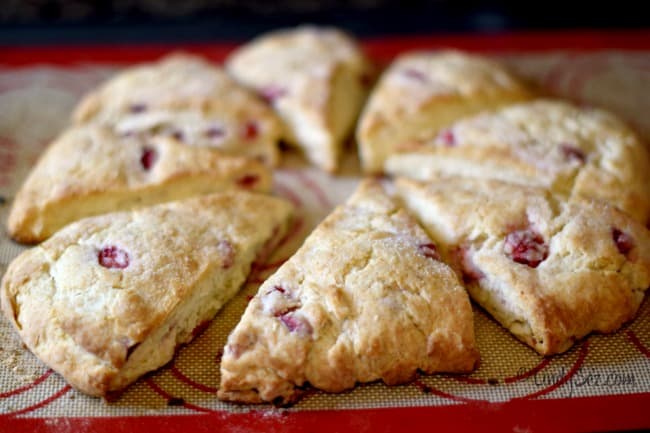 A side view of fresh strawberry cream scones straight out of the oven.