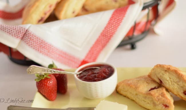 Easy fresh strawberry jam on a yellow plate with fresh strawberry scones.