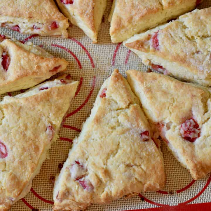 Easy Homemade Fresh Strawberry Cream Scones on a silicon mat.