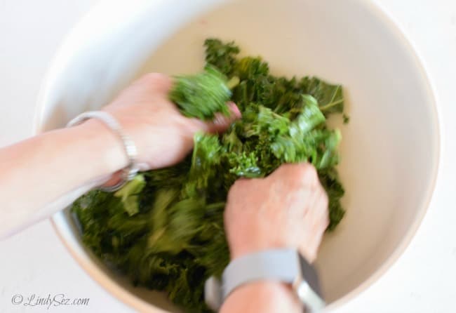 Massaging the kale for the Greek Salad