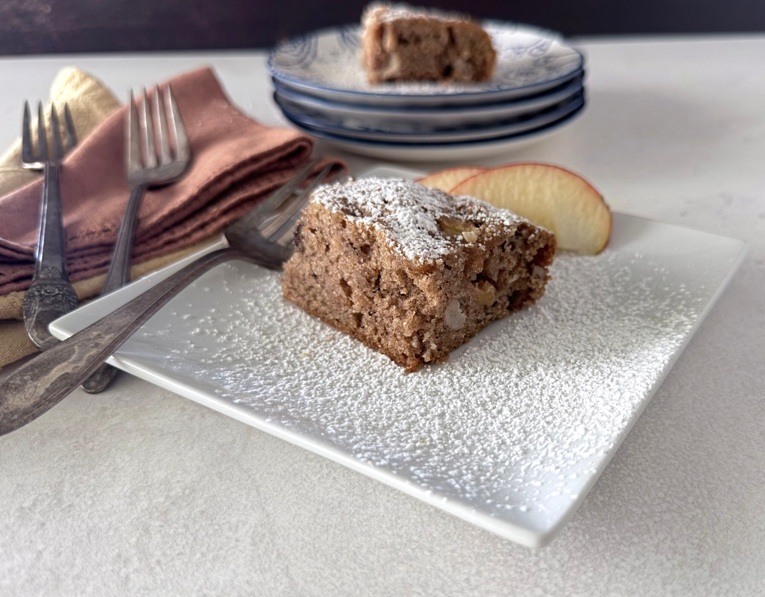 A piece of Apple Chunk Cake cut from the sheet pan.