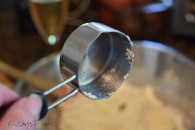 A ¼ cup measure for the batter to make Simple Homemade Buttermilk Drop Biscuits.