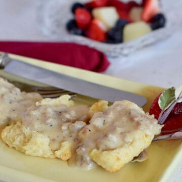 Tasty simple savory sausage gravy on tender biscuits.