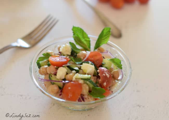 Mediterranean Chickpea - Garbanzo Bean Salad with Feta in a crystal bowl.