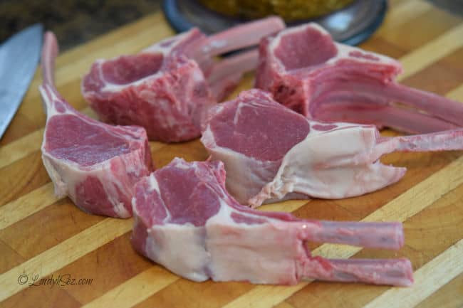 Fresh raw lamb chops on a board.